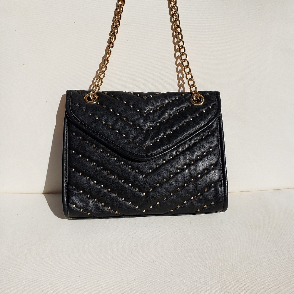 Black purse with gold detail